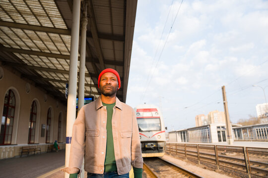 Man Walking at Train Station 