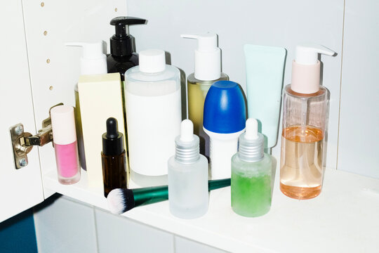Close-up of a bathroom cabinet filled with beauty makeup skincare 