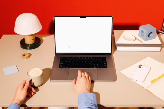 Business laptop mockup with coffee on home office desk