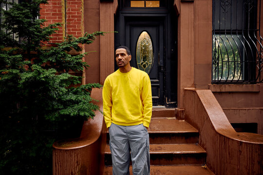 Portrait of a man in front of a house in Brooklyn
