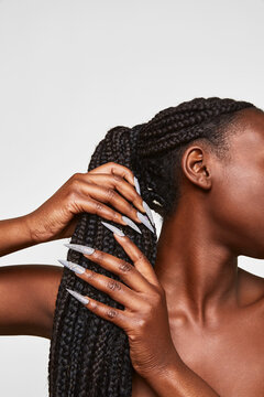 Woman showing long stiletto nails with sparkling detail