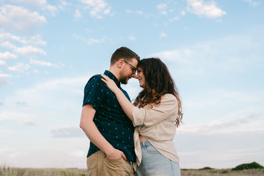 tender moment between couple a the beach