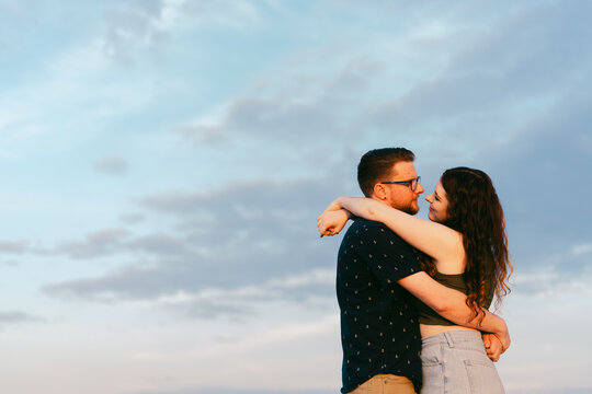 couple embracing and having fun at the beach. 