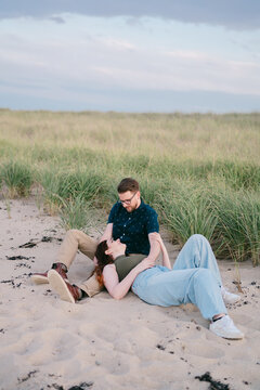 tender moment between couple a the beach