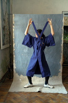 portrait of a woman in a blue kimono