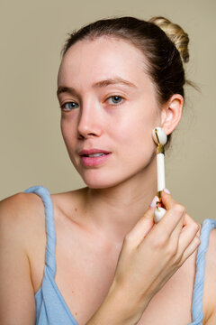 Woman Holding Facial Tool