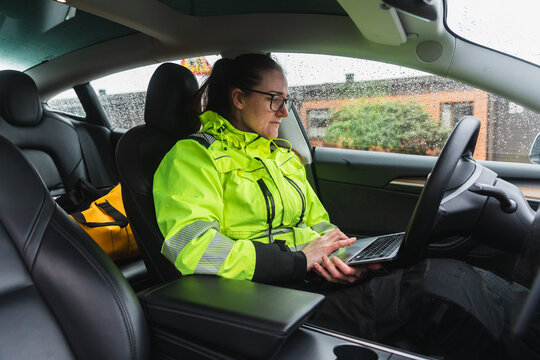 Technician Using Laptop for Remote Diagnostics in Service Vehicle