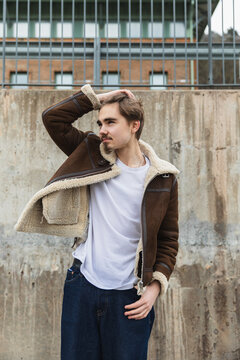 Fashionable Young Man Posing in Brown Shearling Aviator Jacket