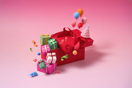Surprise Birthday Gifts Overflowing from a Red Box with Balloons