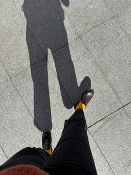 UGC Shadow of woman walking. 