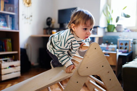 Curious Toddler Climbing Wooden Indoor Play Triangle