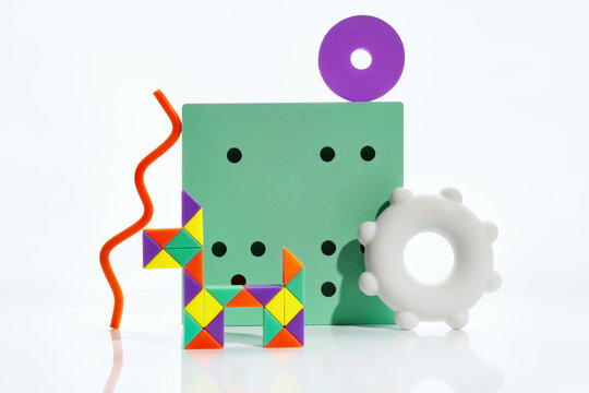 Playful geometric still life assembled from colorful household objects