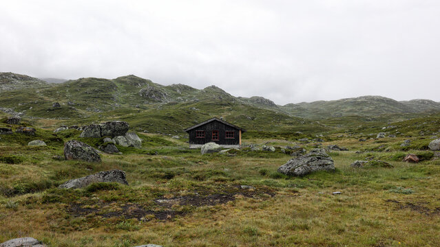 Basic cabin in remote landscape