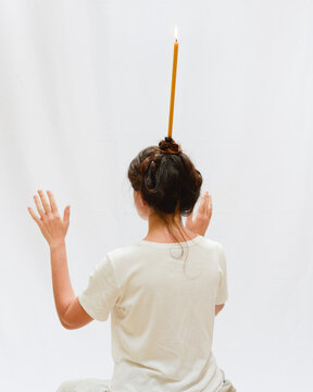 Woman with a candle on her head 4