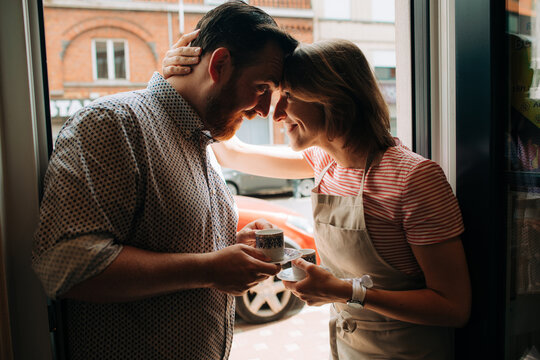 Candid moment of a couple having morning coffee