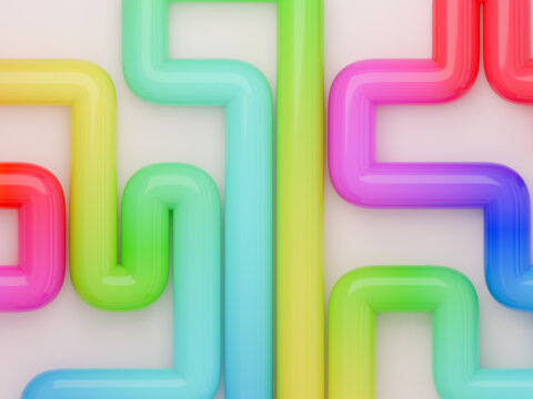 Colorful Plastic Pipes Form a Complex Maze Design on a White Surface