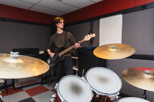 Bass Player Rehearsing Seen from Drummer's Point of view