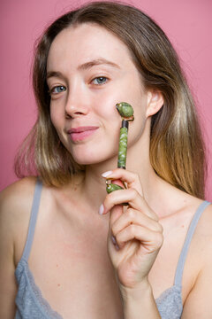 Woman Holding Jade Roller