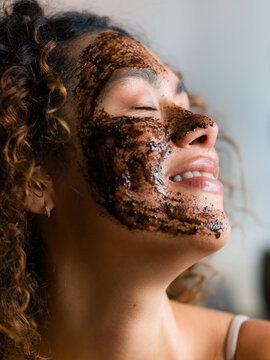 Woman Enjoys Coffee Facial Mask at Home During Daytime