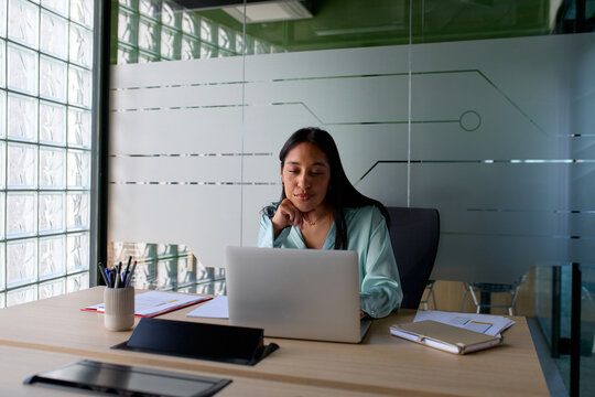 Smiling businesswoman in her office