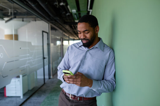 Businessman checks his phone