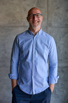 Portrait of a businessman smiles at the camera