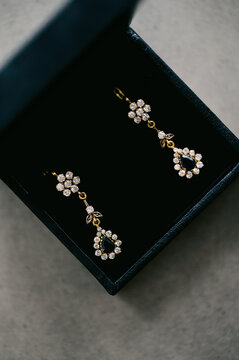 close up of golden studded earrings 