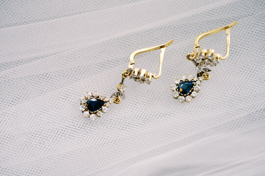 close up of golden studded earrings 
