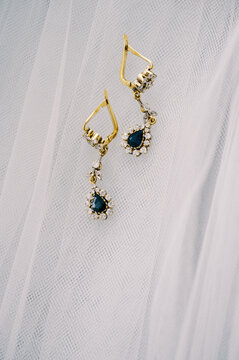 close up of golden studded earrings 