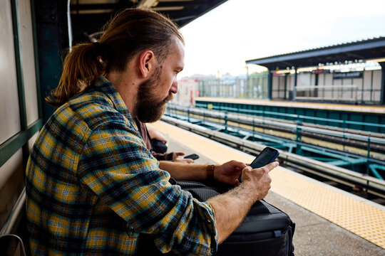 Man is waiting for a train on the platform
