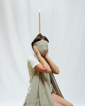 Woman with a candle on her head 2