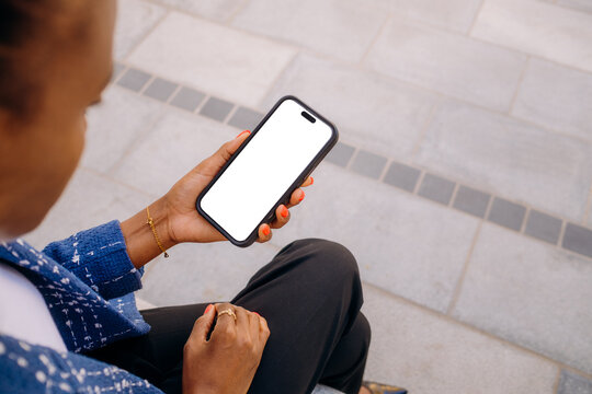 A woman using a mobile phone in the city