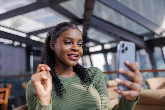 Woman checking her appearance before meeting