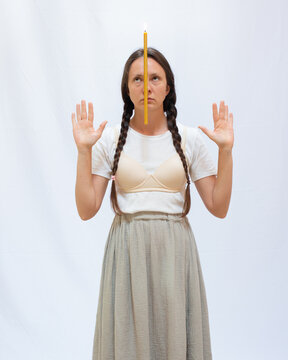 Woman with a candle on her face 5