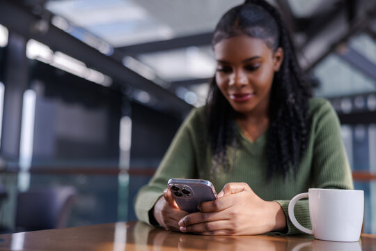 Woman on coffee break with phone