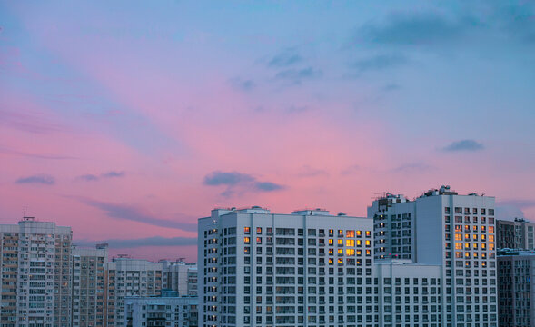 Bright Windows Shine During Sunset in City Skyline
