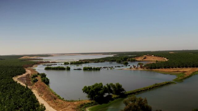 Drone view of a River running through farmland in Modesto, California