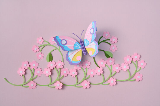 Paper spring craft butterfly on flower garland