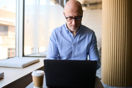 Businessman does his job on a laptop