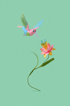 Paper hummingbird and flower on mint spring background