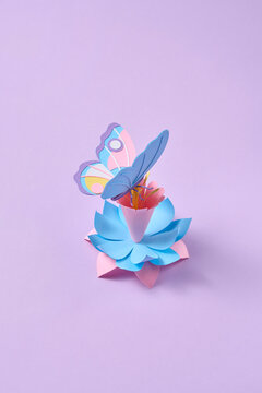 Paper spring craft butterfly on pastel lotus