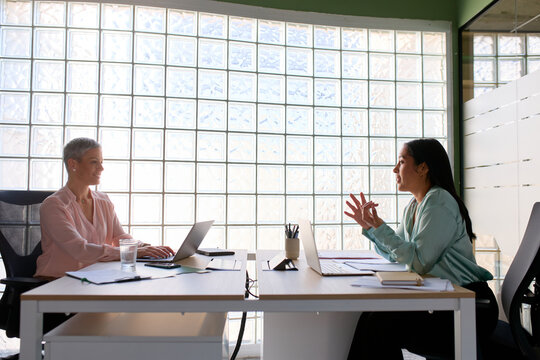 Women have conversation at the office