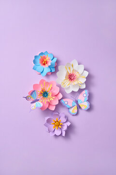 Paper spring craft flower flatlay with butterfly
