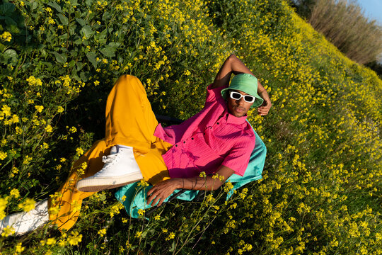 Man Sitting Flower Field