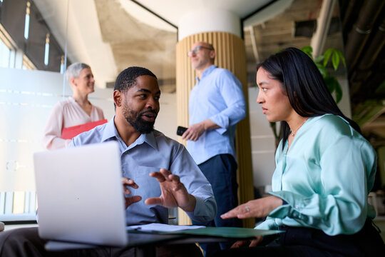 Colleagues discuss business