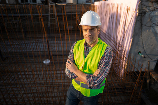 Worker at construction site wearing safety gear