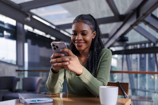 Happy woman receives nice message from friend on smartphone 
