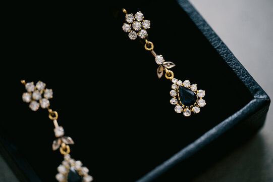 close up of golden studded earrings 