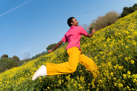 Man Jumping Flower Field