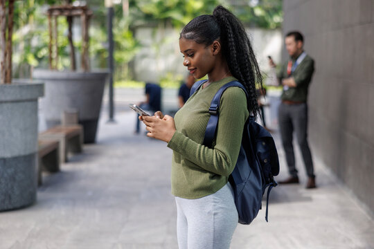 Woman going to the gym using phone